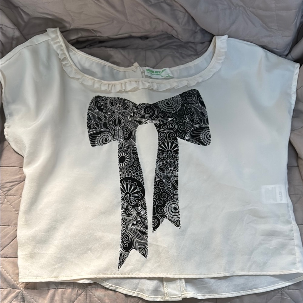 White and Black Top with Bow Design